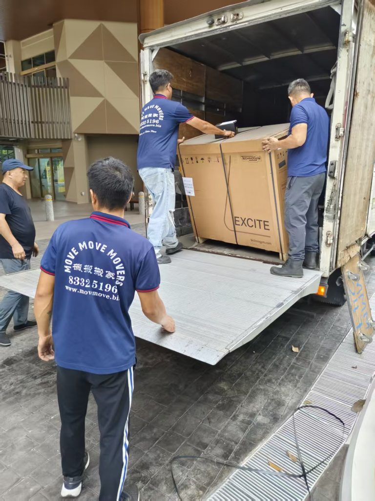 Move Move crew handling a boxed Technogym machine at a truck tail lift